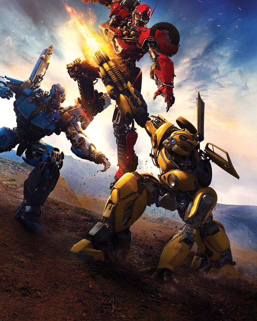 Transformers Bumblebee and Optimus Prime Battle Scene in Desert Landscape HD phone wallpaper