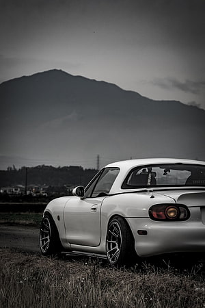 White Mazda Miata MX-5 Coupe Parked in a Field with Mountain Backdrop HD phone wallpaper