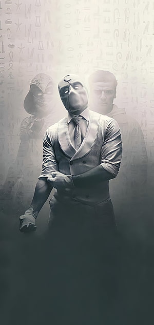 Moon Knight in formal suit with masked figures and hieroglyphic background HD phone wallpaper