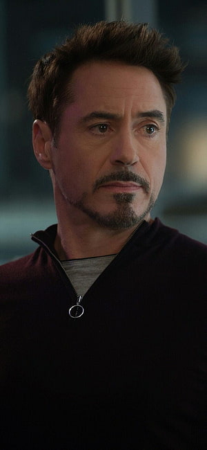 Tony Stark Close-Up Portrait in Dark Zip-Up Jacket with Serious Expression HD phone wallpaper