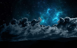 Majestic Night Sky with Glowing Nebula, Stars, and Dramatic Clouds Over Mountain Silhouettes HD wallpaper