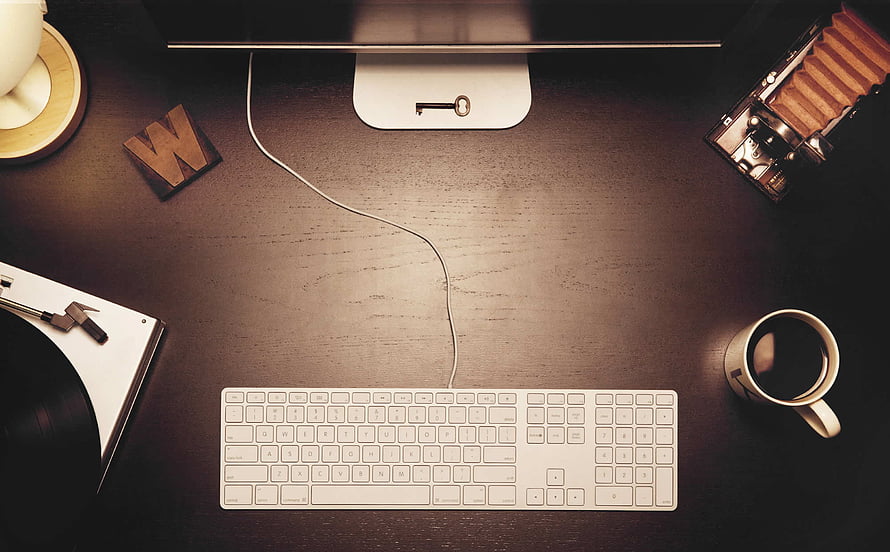 Minimalist Workspace Flat Lay With Keyboard, Coffee, and Vintage Camera HD wallpaper