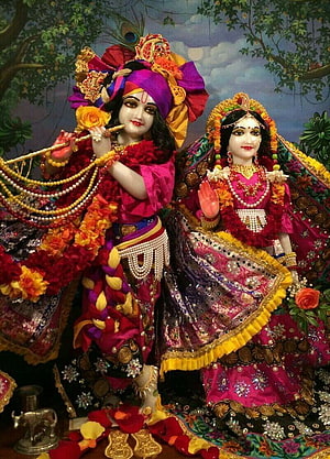 Radhe Krishna Divine Couple in Ornate Traditional Attire with Floral Garlands and Jewelry HD phone wallpaper