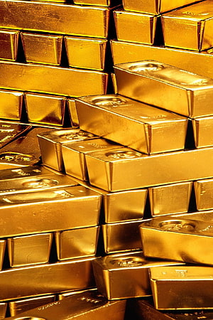 Stacked Gold Bullion Bars: A Close-Up of Precious Metal Wealth and Financial Security HD phone wallpaper
