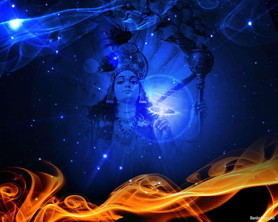 Mystical Indian Deity with Ornate Headdress and Glowing Orb in Cosmic Blue Setting HD wallpaper
