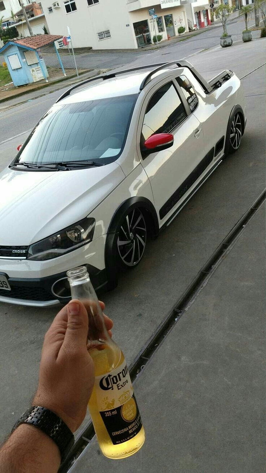White Volkswagen Cross Polo with lowered suspension and red mirror accents parked on a city street HD phone wallpaper