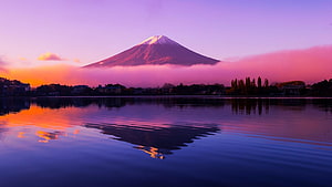 Mount Fuji at Sunset with Vibrant Purple and Pink Sky Reflected in Lake HD wallpaper