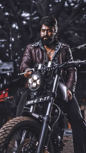 Rocky Bhai from KGF on a Custom Chopper Motorcycle in a Dark Industrial Setting HD phone wallpaper