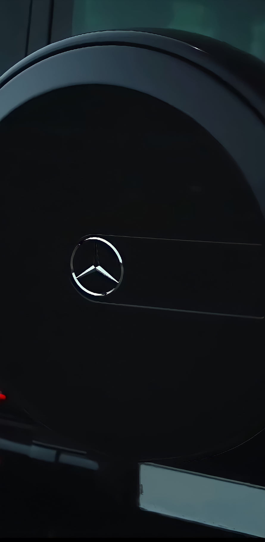 Mercedes-Benz G-Wagon Rear Emblem Close-Up on Glossy Black Body HD phone wallpaper