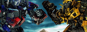 Transformers Optimus Prime and Bumblebee Face Off in Cinematic Wide Shot HD wallpaper