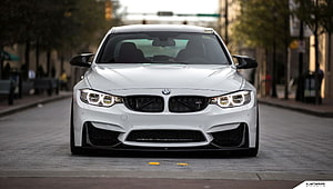 White BMW F80 M3 Front View on City Street with Aggressive Bumper and LED Headlights HD wallpaper
