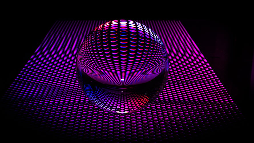 Glowing LED Sphere on a Grid of Purple and Pink Lights in a Dark Setting HD wallpaper