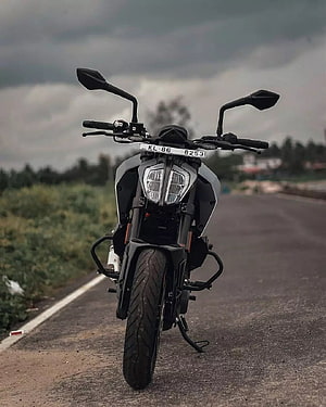 KTM Duke 250 Front View on a Rural Road Under Overcast Skies HD phone wallpaper