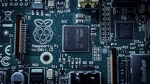 Raspberry Pi Circuit Board Close-Up with Microchips and Electronic Components HD wallpaper