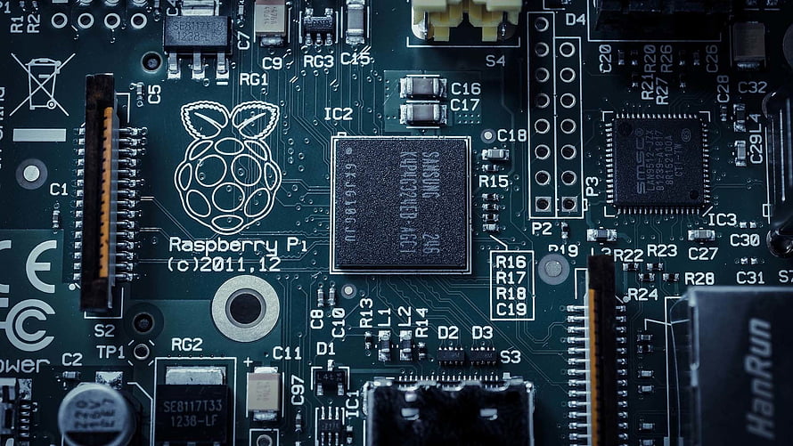 Raspberry Pi Circuit Board Close-Up with Microchips and Electronic Components HD wallpaper