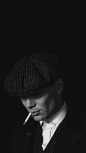 Tommy Shelby in Pinstripe Flat Cap and Suit Smoking a Cigarette in Black and White HD phone wallpaper