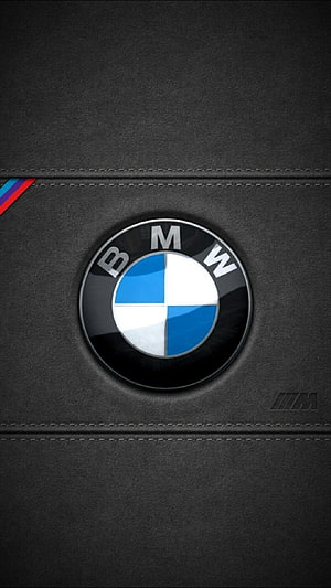 BMW M Power Emblem on Black Leather Surface with Stitched Detailing HD phone wallpaper