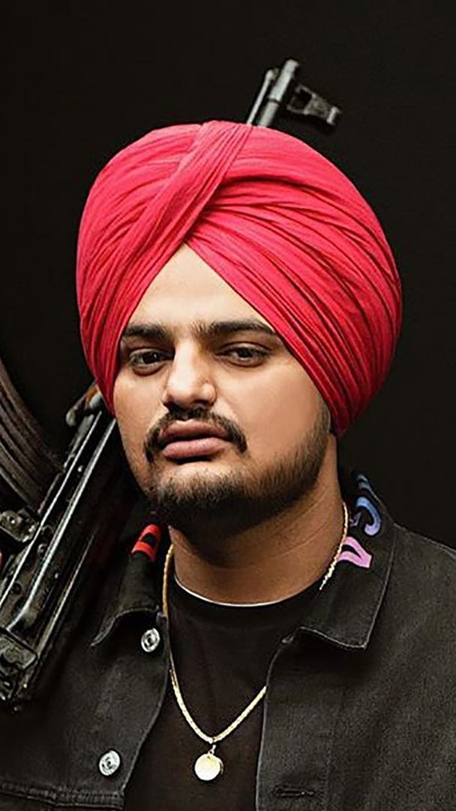 Sidhu Moose Wala Portrait in Red Turban with Firearms Against Black Background HD phone wallpaper