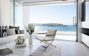 Modern Coastal Living Room With Ocean View And White Marble Coffee Table HD wallpaper