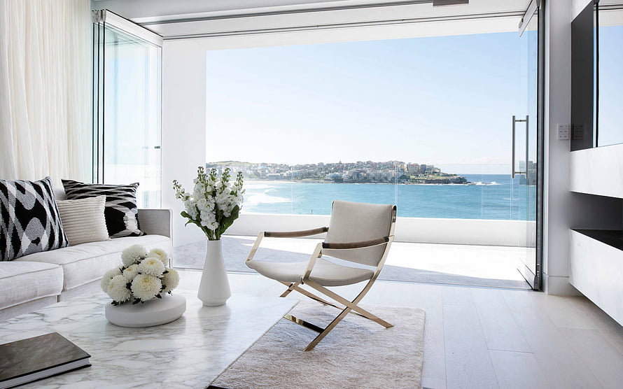 Modern Coastal Living Room With Ocean View And White Marble Coffee Table HD wallpaper