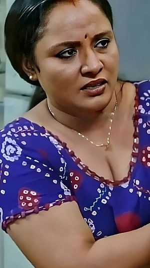 Nisha Sarang in a blue patterned blouse with a concerned expression HD phone wallpaper