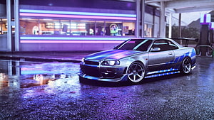 Nissan Skyline GT-R R34 in Neon-Lit Night Street Scene HD wallpaper