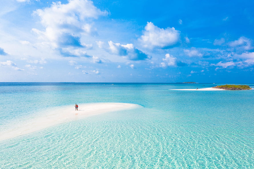 Aerial View of Pristine White Sandbar in Turquoise Tropical Waters Under a Bright Blue Sky HD wallpaper