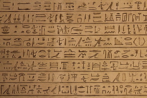 Ancient Egyptian Hieroglyphic Carvings on Stone Surface HD wallpaper