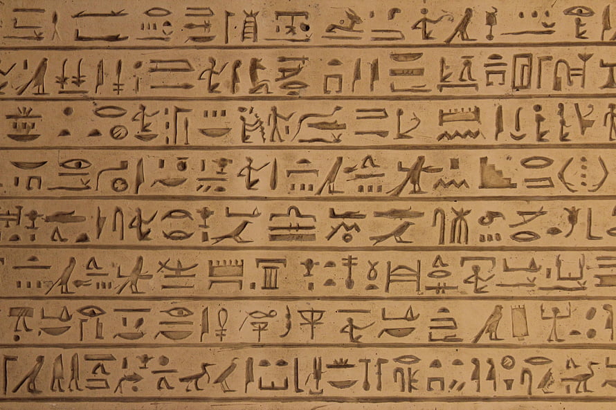 Ancient Egyptian Hieroglyphic Carvings on Stone Surface HD wallpaper