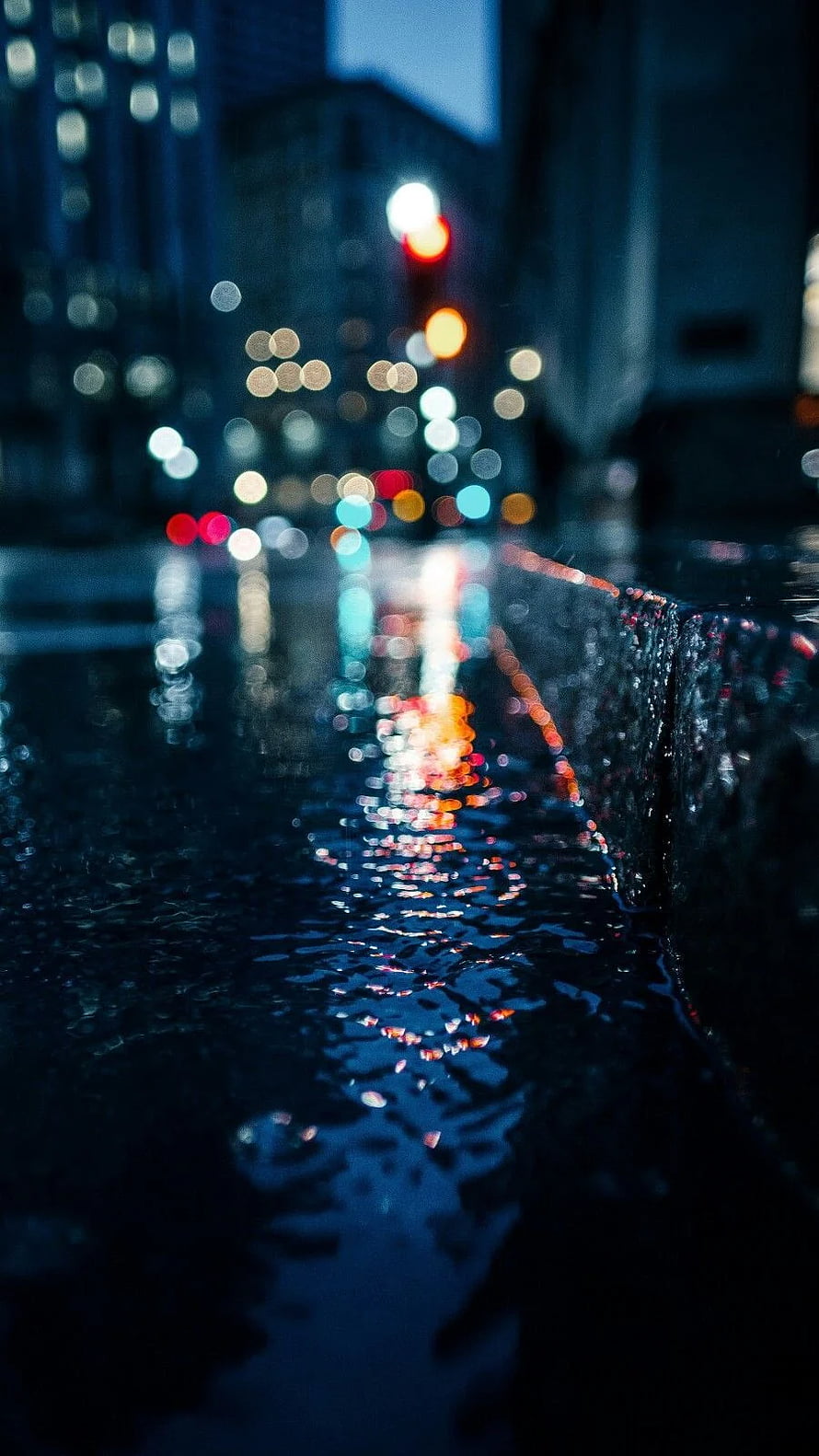 Moody Nighttime Cityscape with Wet Street Reflections and Bokeh Lights HD phone wallpaper