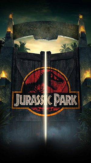 Jurassic Park Iconic Logo on Grand Stone Gate with Torches and Misty Jungle Atmosphere HD phone wallpaper
