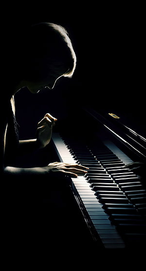 Dramatic Silhouette of a Pianist Playing in Low Light HD phone wallpaper