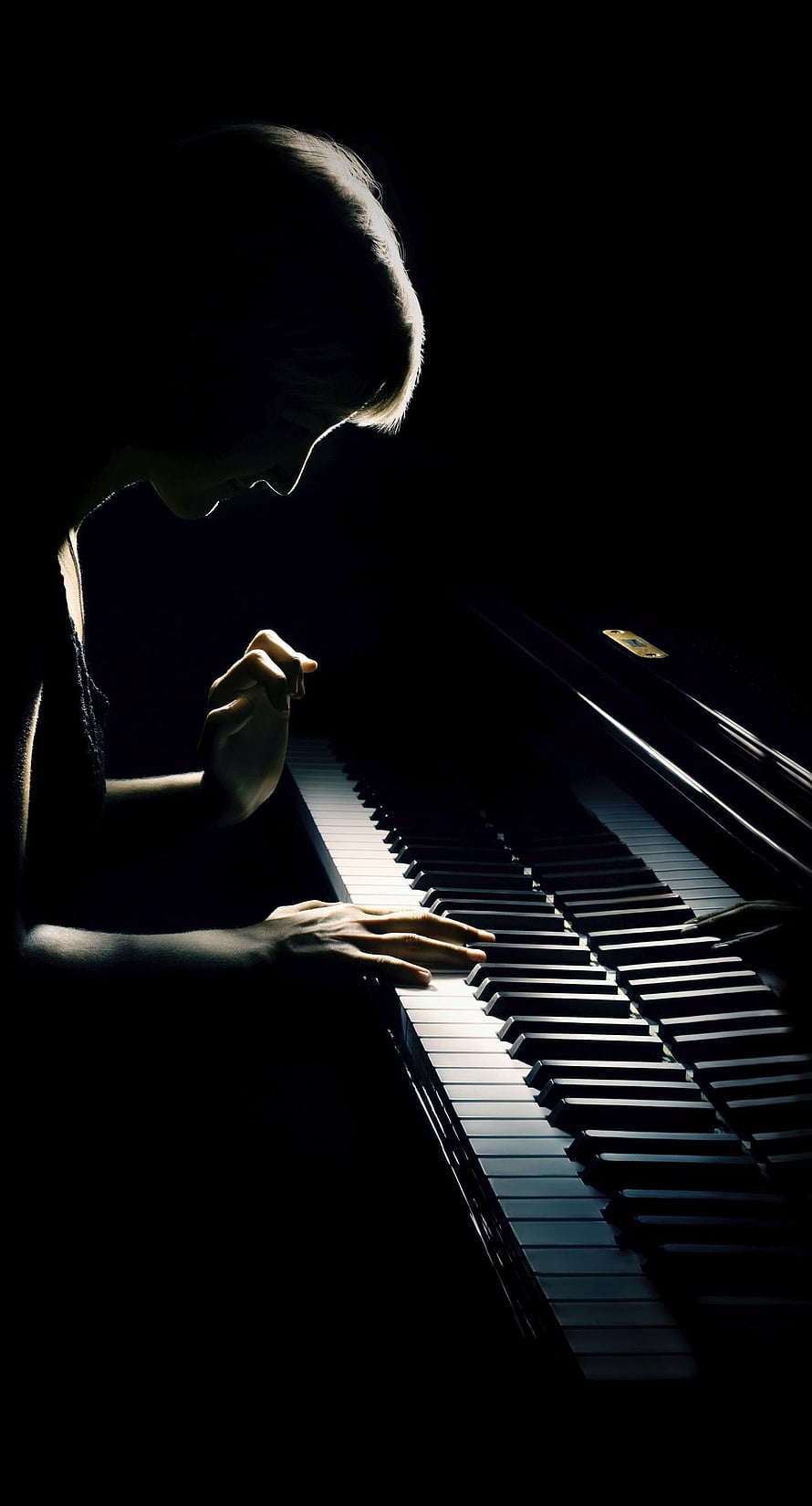 Dramatic Silhouette of a Pianist Playing in Low Light HD phone wallpaper