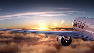Qatar Airways aircraft wing soaring above golden clouds at sunset HD wallpaper