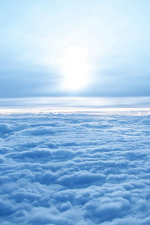 Aerial View of Endless Cloud Sea Under Bright Sunlight HD phone wallpaper