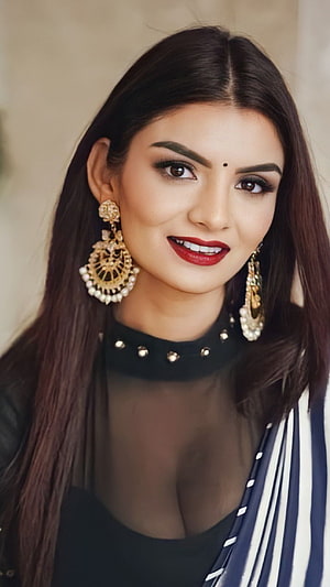 Anveshi Jain Portrait Wearing Traditional Gold Jhumka Earrings and Black Top HD phone wallpaper