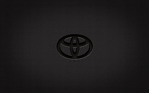 Toyota emblem on dark carbon fiber texture with subtle diagonal weave pattern HD wallpaper