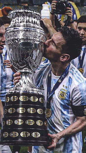 Lionel Messi Kissing The Copa America Trophy In Argentina National Team Jersey HD phone wallpaper
