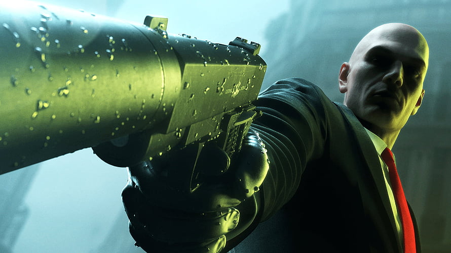 Hitman Agent 47 Aiming Suppressed Pistol in Dark Suit and Red Tie HD wallpaper