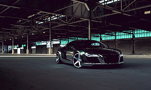Audi R8 sports car parked in a dark industrial warehouse with teal window light HD wallpaper