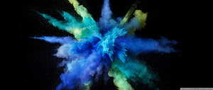 Vibrant Color Powder Explosion in Blue, Cyan, and Yellow Against a Black Background HD wallpaper