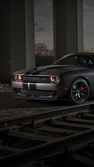 Matte Black Dodge Challenger SRT Hellcat with Red Accents on Railroad Tracks HD phone wallpaper