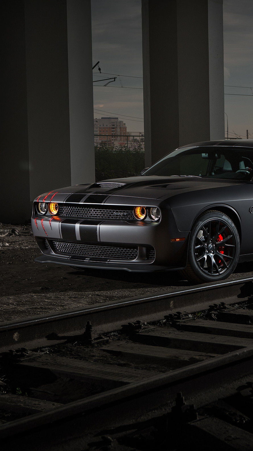 Matte Black Dodge Challenger SRT Hellcat with Red Accents on Railroad Tracks HD phone wallpaper