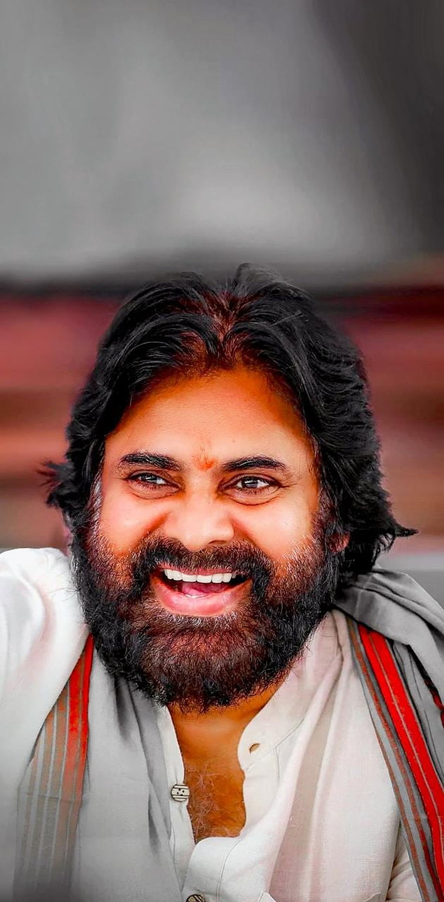 Pawan Kalyan Portrait with Warm Smile and Traditional Attire HD phone wallpaper