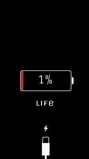 Minimalist Low Battery Life Concept with Charging Icon on Black Background HD phone wallpaper