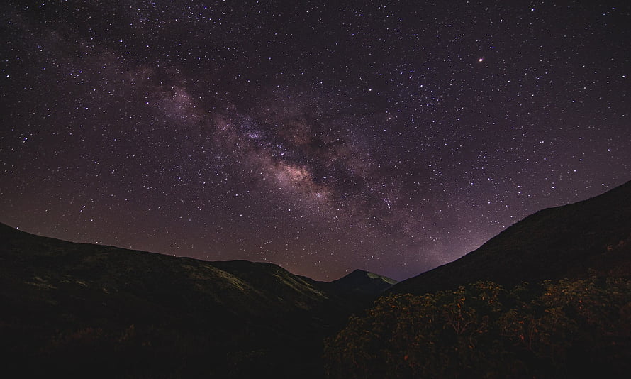 Milky Way Galaxy Arching Over Dark Mountain Ridges and Starry Night Sky HD wallpaper
