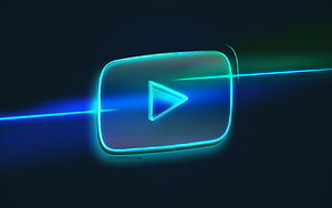 Glowing YouTube Play Button with Neon Blue Light Streaks on Dark Background HD wallpaper