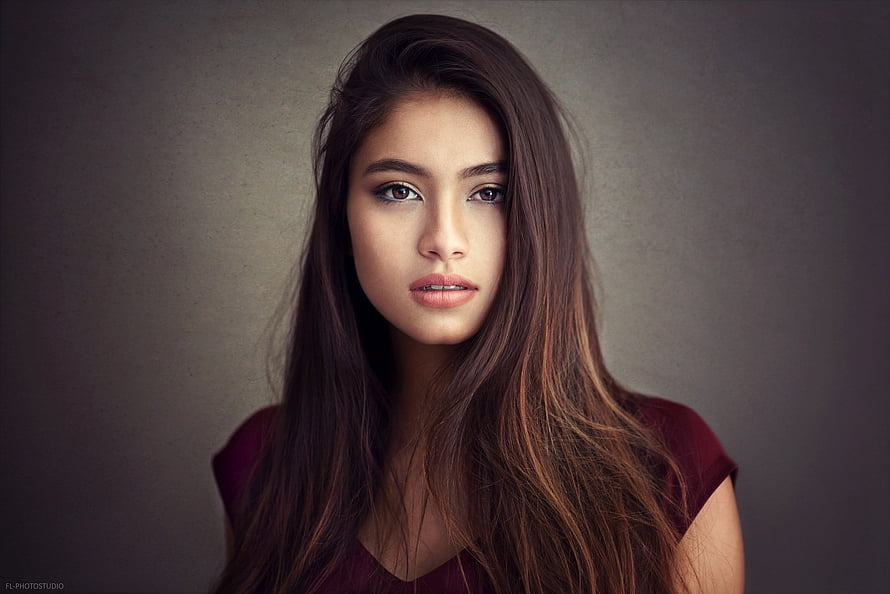 Studio Portrait of a Young Woman with Long Dark Hair and Maroon Top HD wallpaper