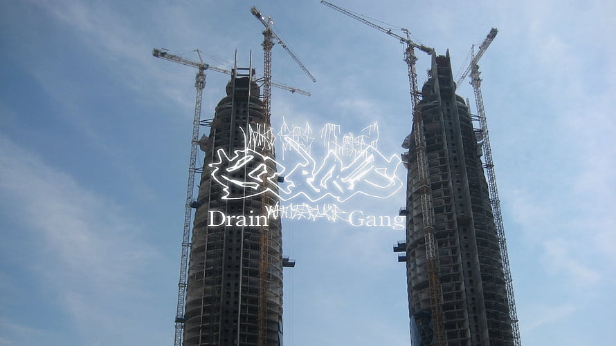 Drain Gang Logo Over Twin Construction Towers Under a Blue Sky HD wallpaper