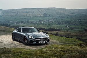 Mercedes-AMG GT S Grey Coupe Parked on a Scenic Countryside Hilltop HD wallpaper